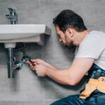 a-Plumber-in-Seattle-fixing-a-sink