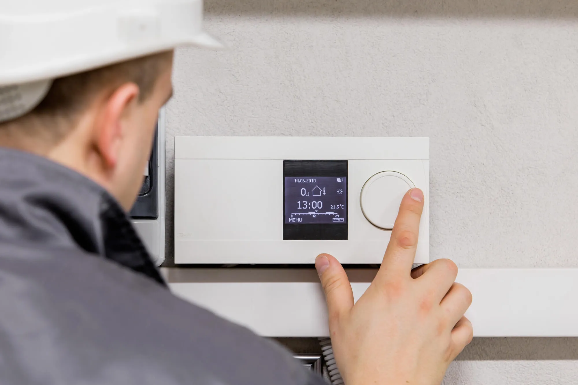 HVAC Services Seattle fixing thermostat